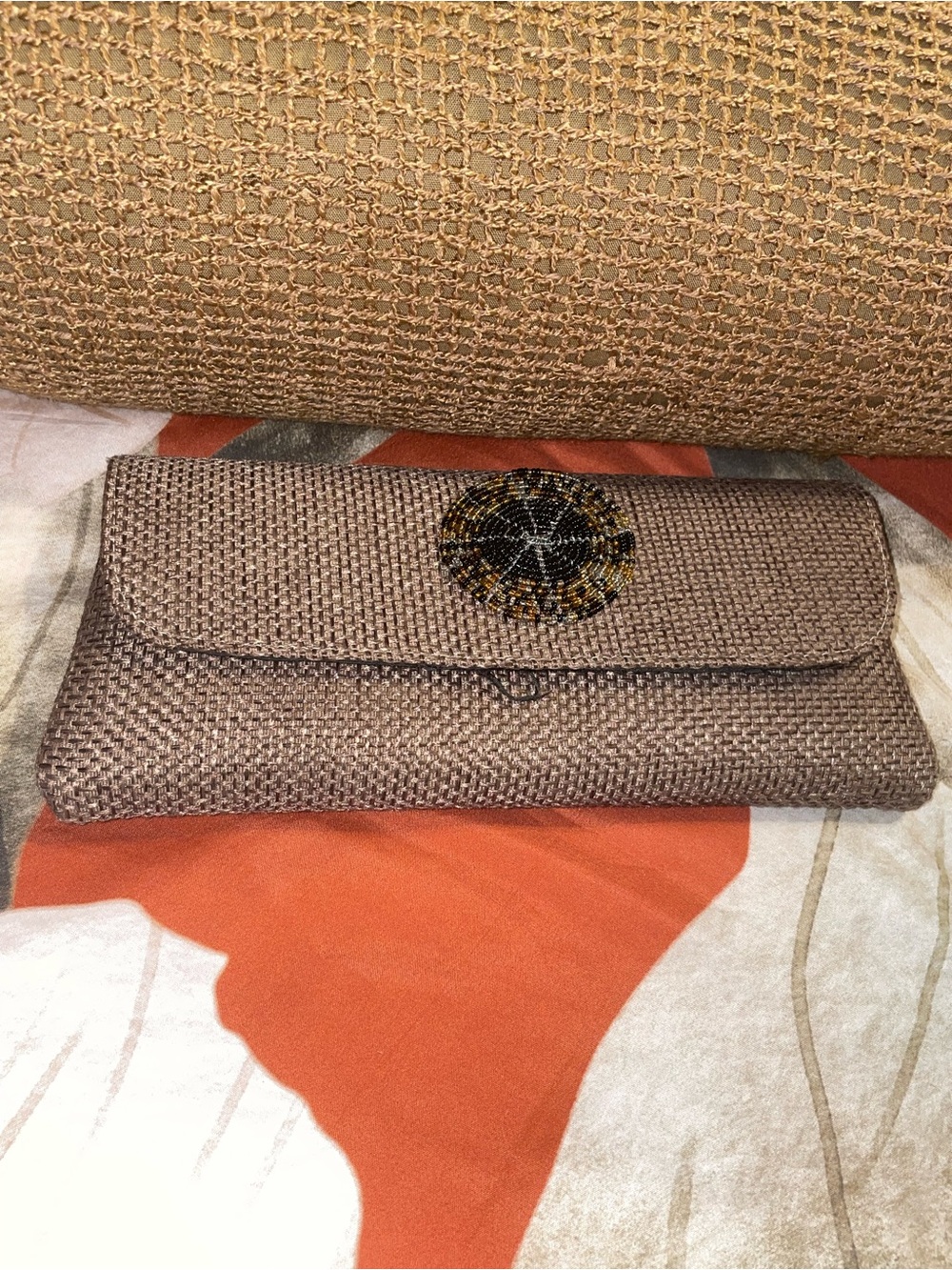 Woven Tan Straw Clutch with Decorative leopard Beaded Accent